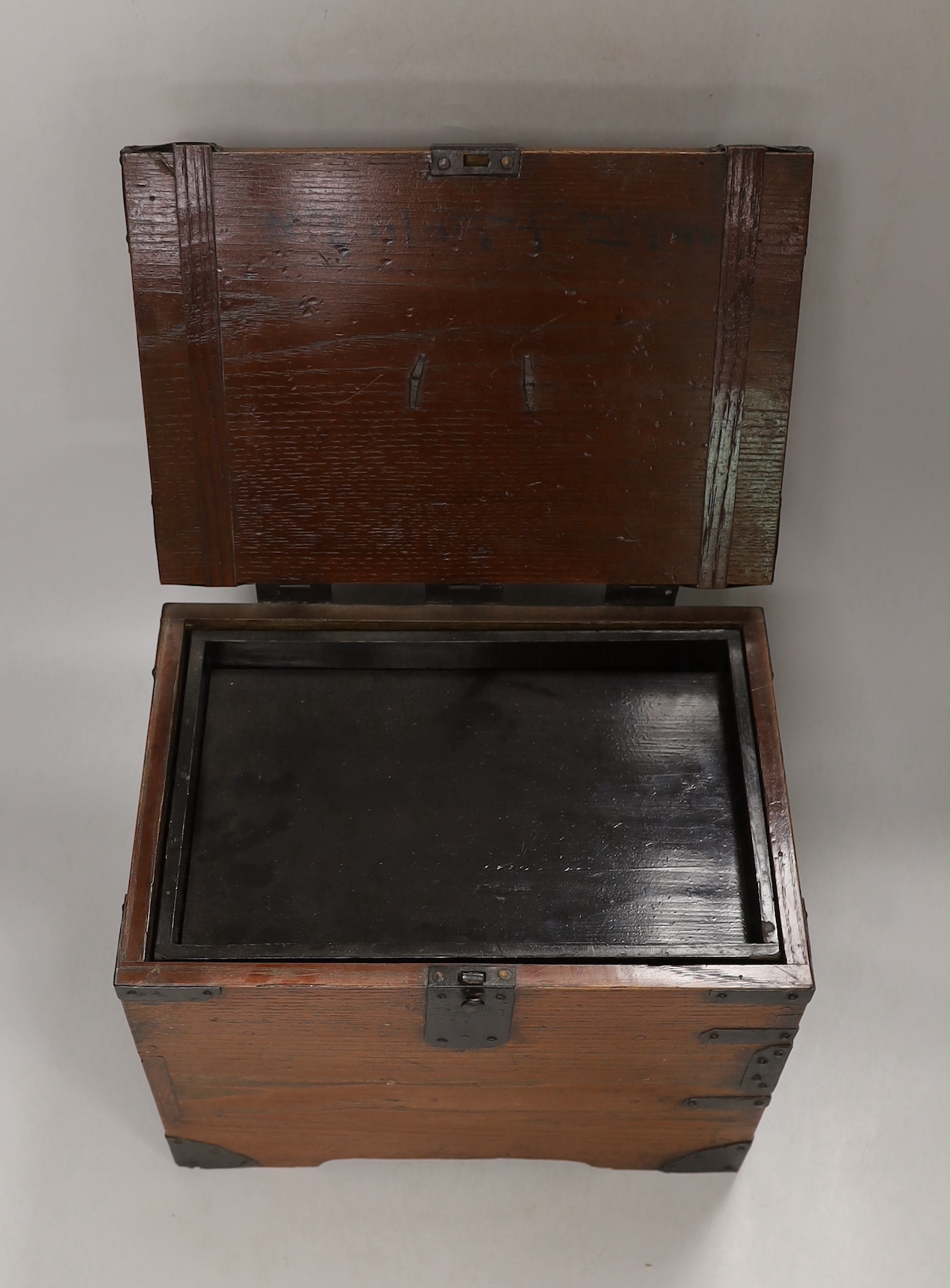 A Japanese iron mounted box, with black lacquer interior tray, box 30cm wide